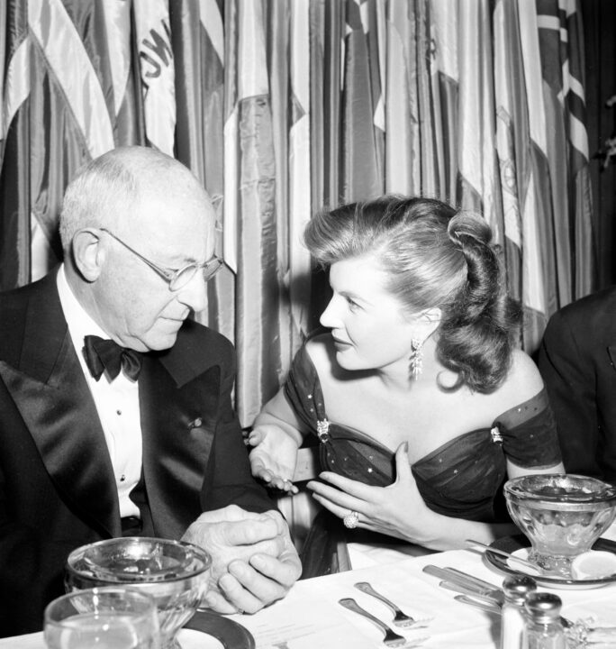 Cecil B. DeMille with Corinne Calvert attends the Golden Globes awards party in Los Angeles, California.