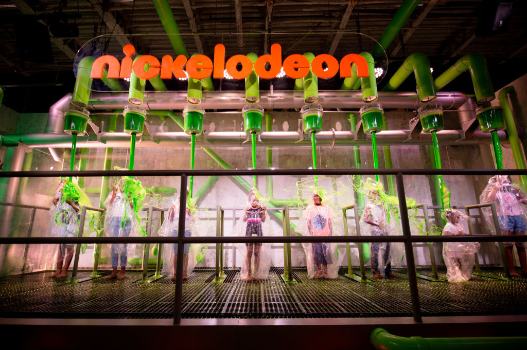 Guests get doused in Nickelodeon’s iconic green slime at Slime City Atlanta preview on June 13, 2019 in Atlanta, Georgia