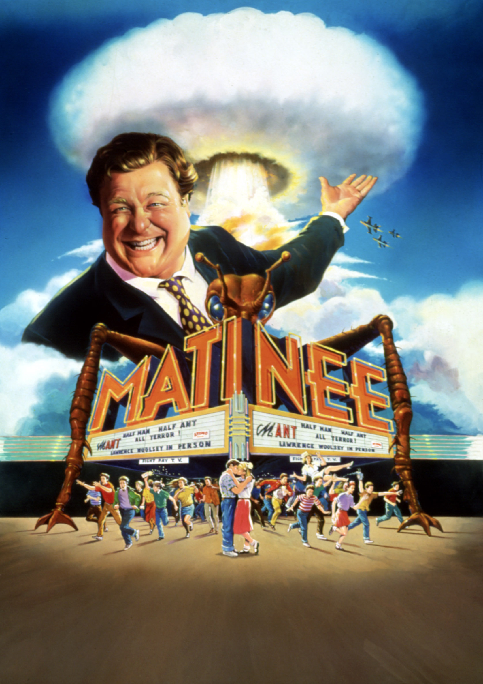 movie poster for the 1993 film "Matinee." It is an illustration of an early '60s movie theater, behind which is a nuclear mushroom cloud. In front of that cloud is John Goodman as his movie promoter character, grinning proudly above the theater's marquee, which has the films' title "Matinee," as well as the title of the film-within-the-film called "Mant!"