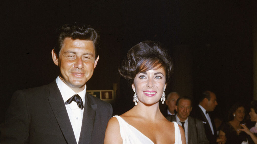 British born actor Elizabeth Taylor and her fourth husband American singer and actor Eddie Fisher arrive at a formal event, c. 1962