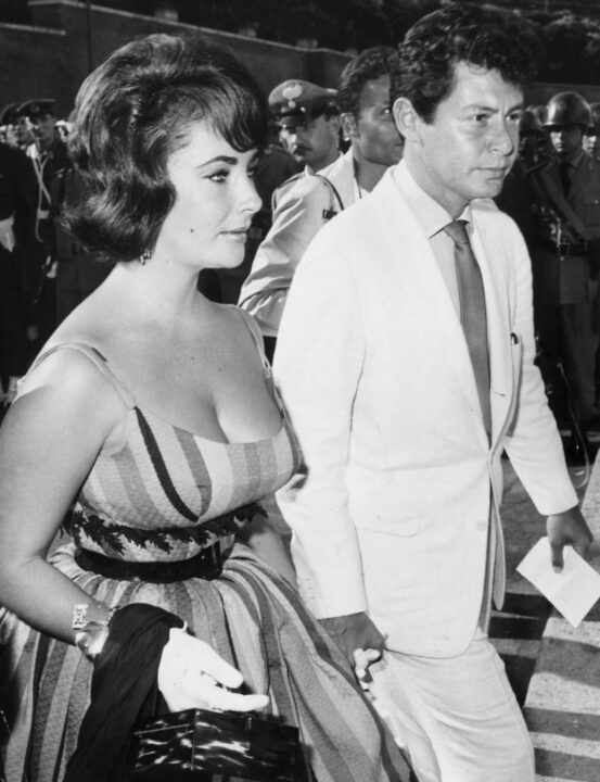 26th August 1960: American actress Elizabeth Taylor with her husband, singer Eddie Fisher attending the opening ceremony of the Olympic games in Rome