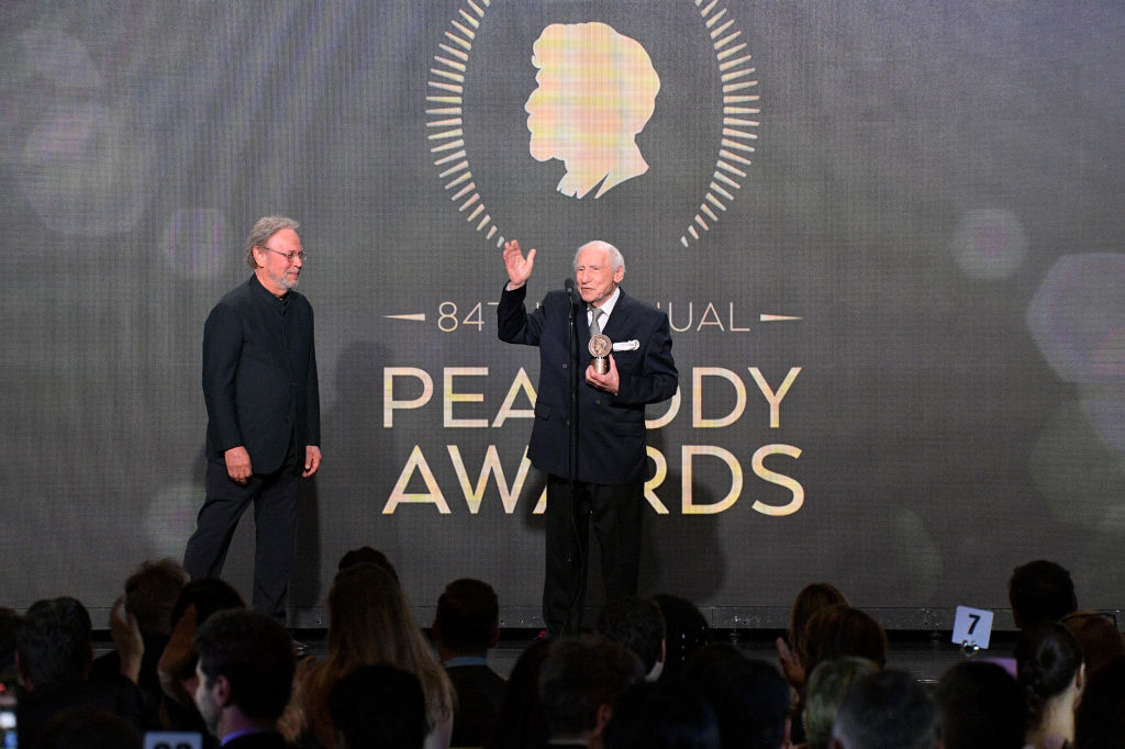 Mel Brooks (R) accepts the Career Achievement Award from Billy Crystal onstage during the 2024 Peabody Awards at Beverly Wilshire, A Four Seasons Hotel on June 09, 2024 in Beverly Hills, California