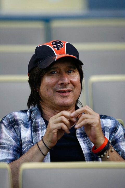 Steve Perry, lead vocalist of the rock band Journey, watches the game between the San Francisco Giants and the Los Angeles Dodgers at Dodger Stadium on May 8, 2009 in Los Angeles, California