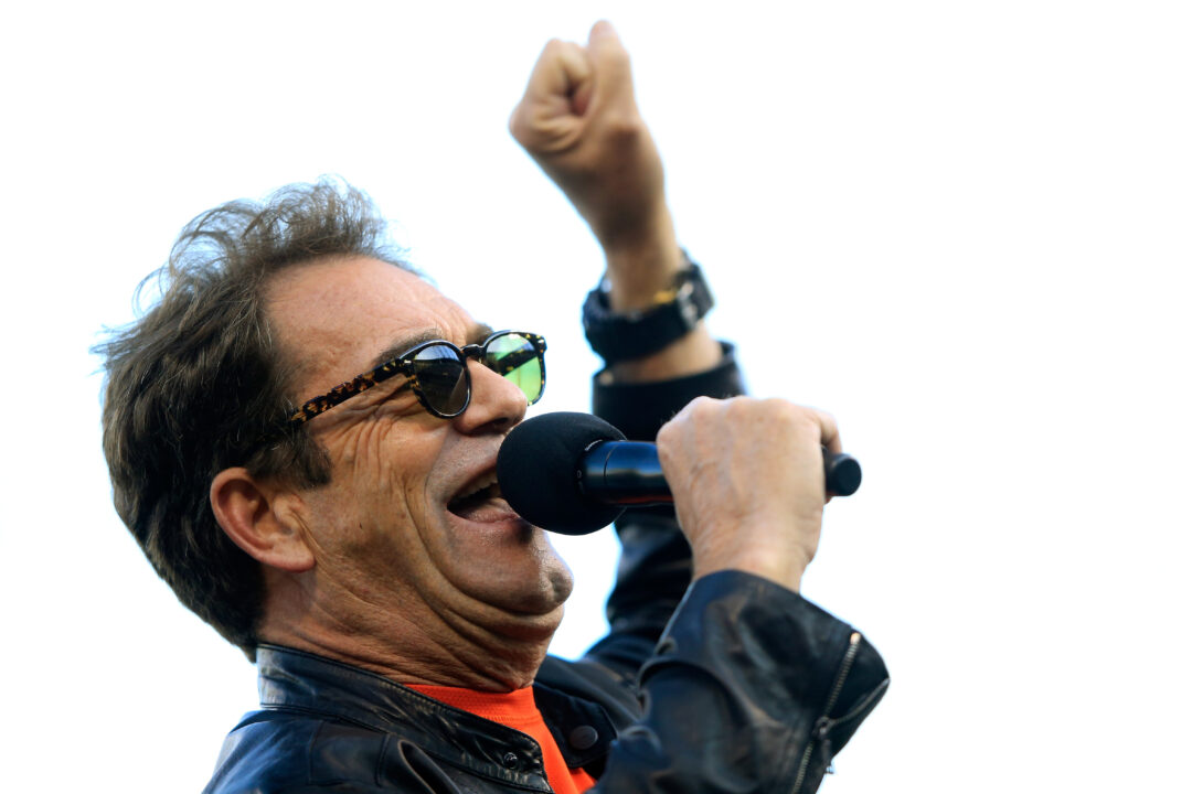 SAN FRANCISCO, CA - OCTOBER 24: Singer Huey Lewis pumps out of the crowd before the San Francisco Giants take on the Kansas City Royals in Game Three of the 2014 World Series at AT&T Park on October 24, 2014 in San Francisco, California. 