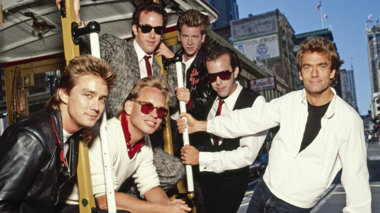 Huey Lewis and the News ride the San Francisco cable car for Rolling Stone Magazine.