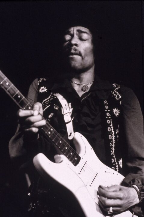 American musician Jimi Hendrix (1942 - 1970) performs onstage, late 1960s