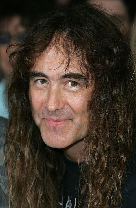 Bass player Steve Harris of Iron Maiden poses for a photograph as he is inducted into Hollywood's Rock Walk, at the Guitar Center on August 19, 2005 in Hollywood, Los Angeles, California