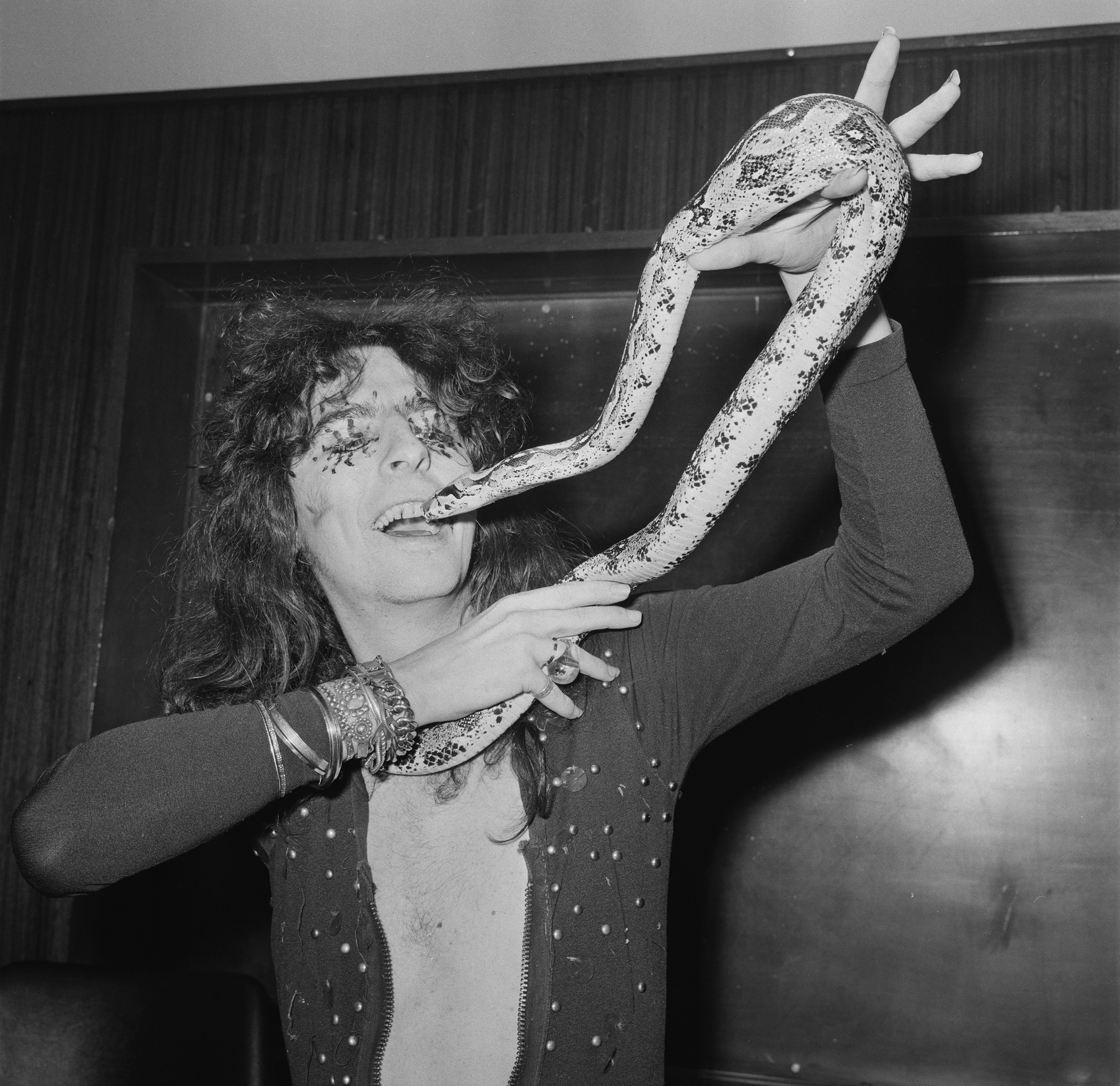 American singer and songwriter Alice Cooper with his 6-foot python, UK, 21st October 1971.