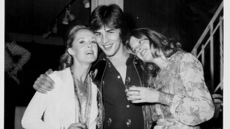 Actress Melanie Griffith with her boyfriend, actor Don Johnson, and her mother, actress Tippi Hedren, attending a party, California, October 26th 1973