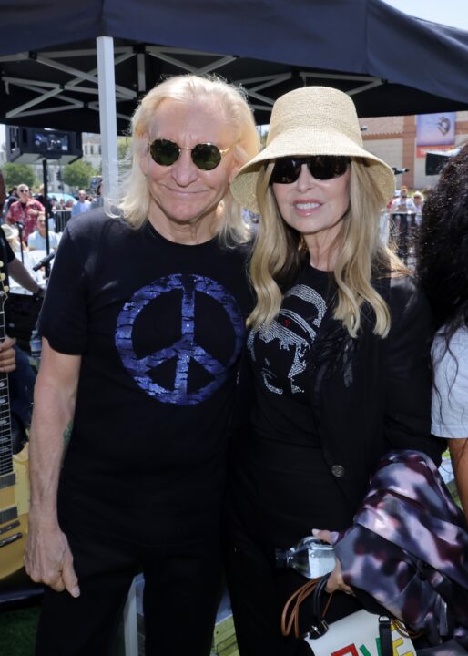 BEVERLY HILLS, CALIFORNIA - JULY 07: (L-R) Joe Walsh and Marjorie Bach attend Ringo's Peace & Love Birthday Celebration at Beverly Hills Garden Park on July 07, 2024 in Beverly Hills, California. 