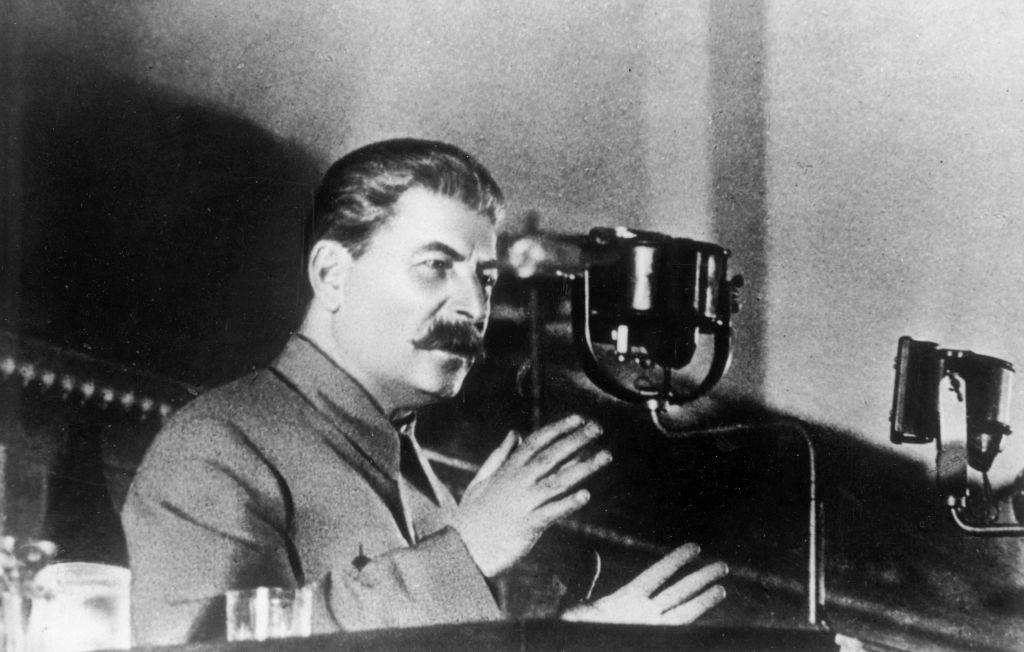 1936: Soviet leader Joseph Stalin (Iosif Vissarionovich Dzhugashvili, 1879 - 1953), addressing the Extraordinary 8th All Union Congress of Soviets on the draft of the USSR's constitution. 