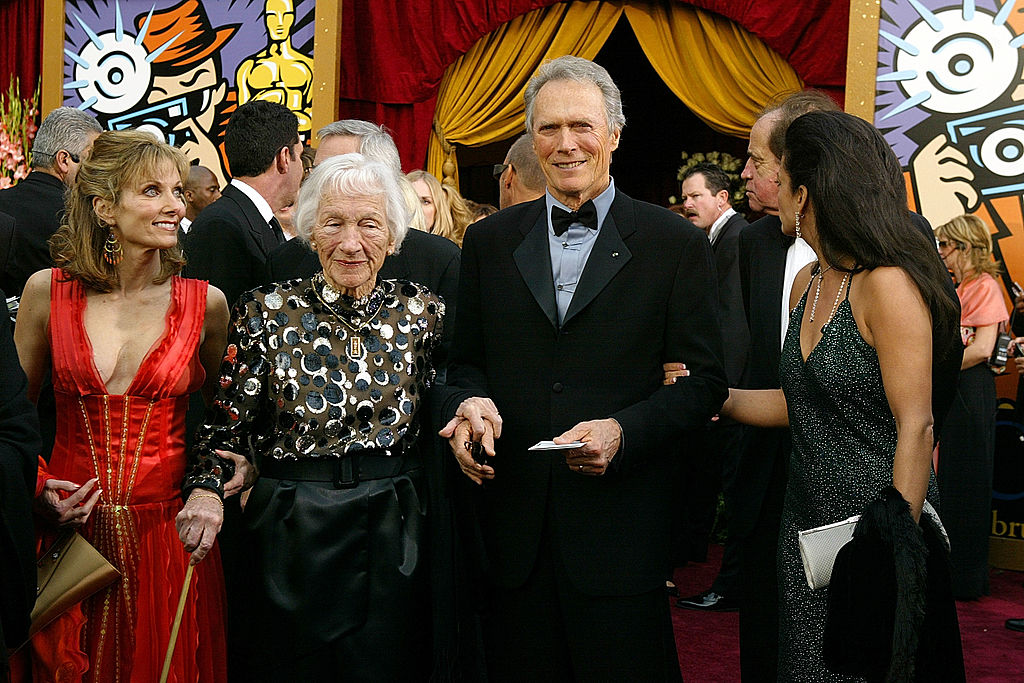 Clint Eastwood, Laurie Murray, Ruth Wood and Dina Ruiz attend the 76th Annual Academy Awards on February 29, 2004 at the Kodak Theater, in Hollywood, California