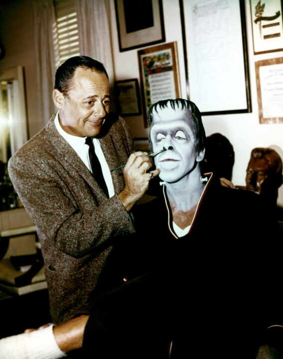 THE MUNSTERS, makeup artist applying makeup to Fred Gwynne, 1964-1966.