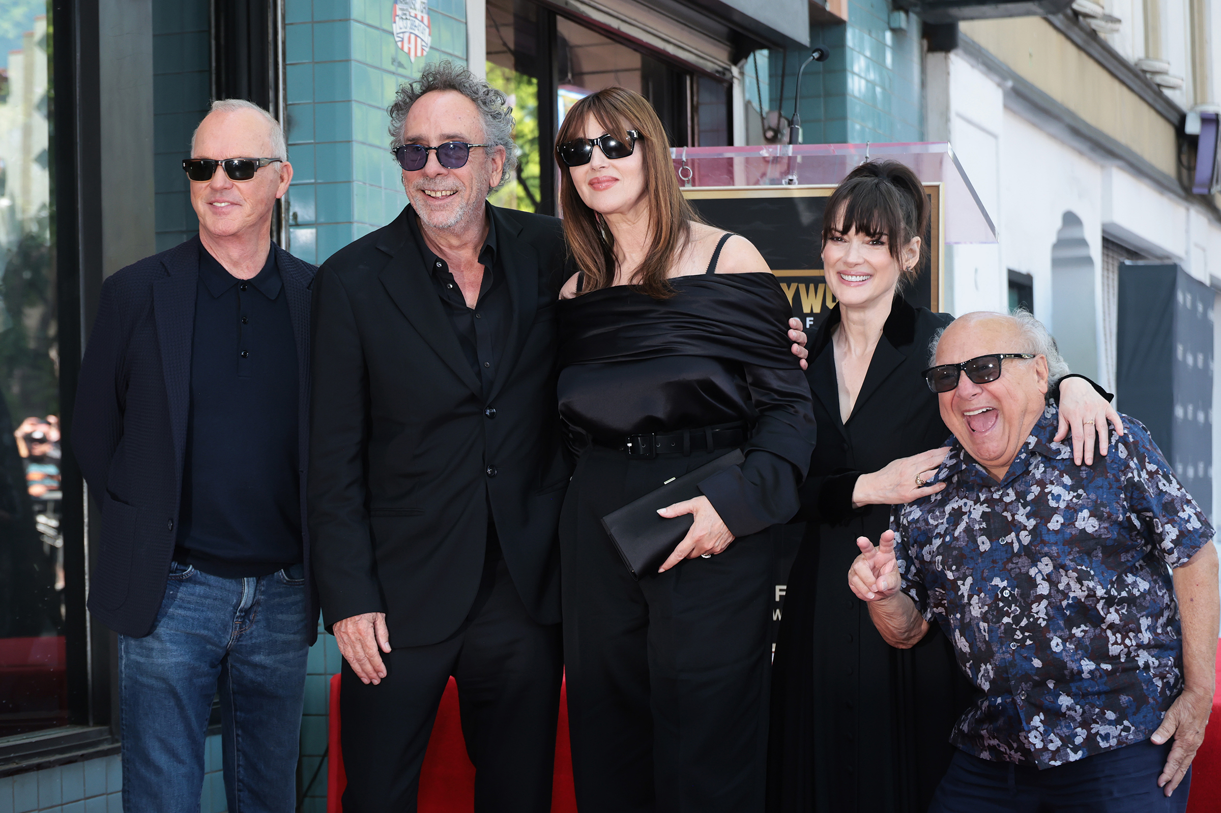 HOLLYWOOD, CALIFORNIA - SEPTEMBER 03: (L-R) Michael Keaton, Tim Burton, Monica Bellucci, Winona Ryder and Danny DeVito attend Tim Burton honored with star on Hollywood Walk of Fame on September 03, 2024 in Hollywood, California.