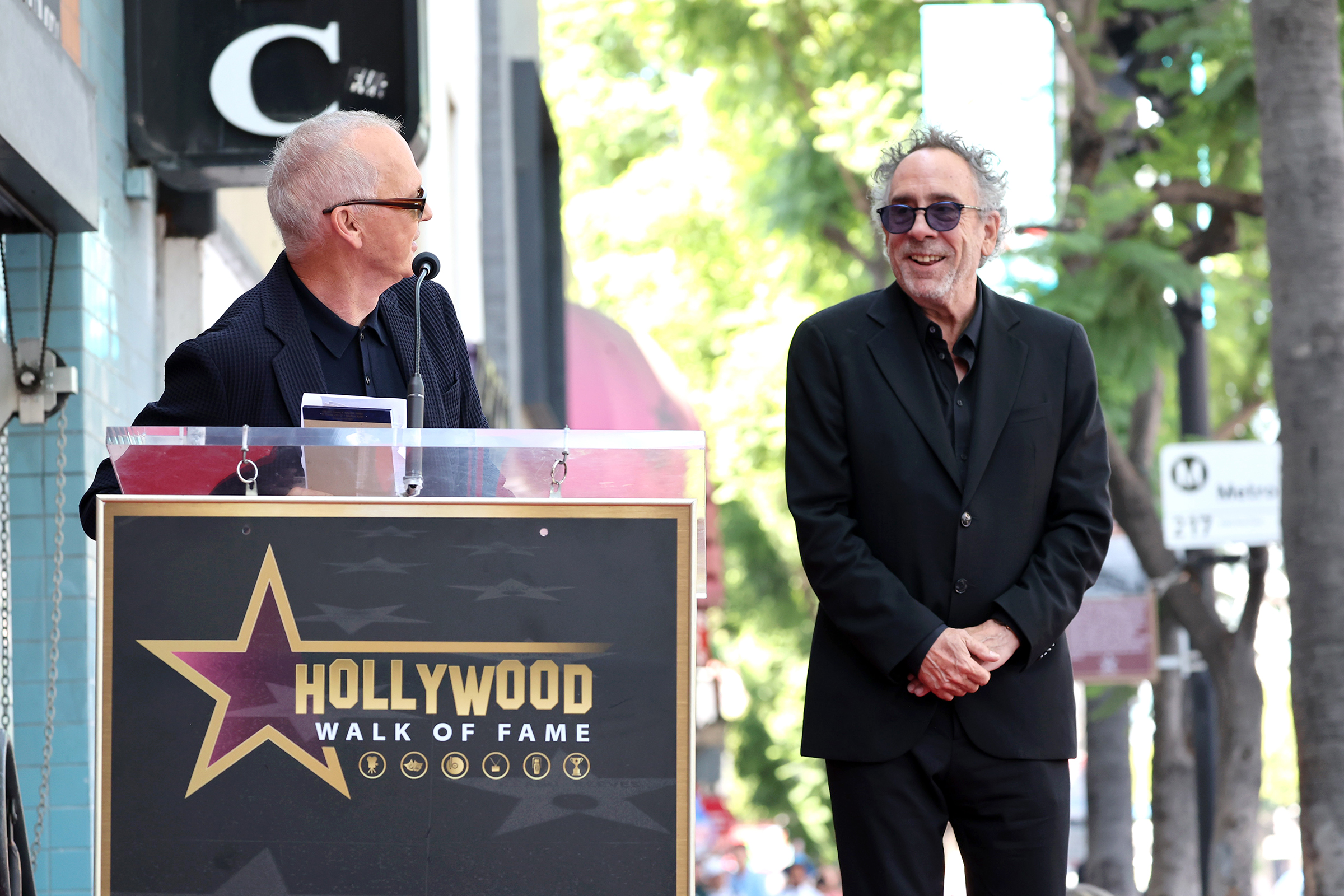 HOLLYWOOD, CALIFORNIA - SEPTEMBER 03: Michael Keaton (L) and Tim Burton attend Tim Burton honored with star on Hollywood Walk of Fame on September 03, 2024 in Hollywood, California.