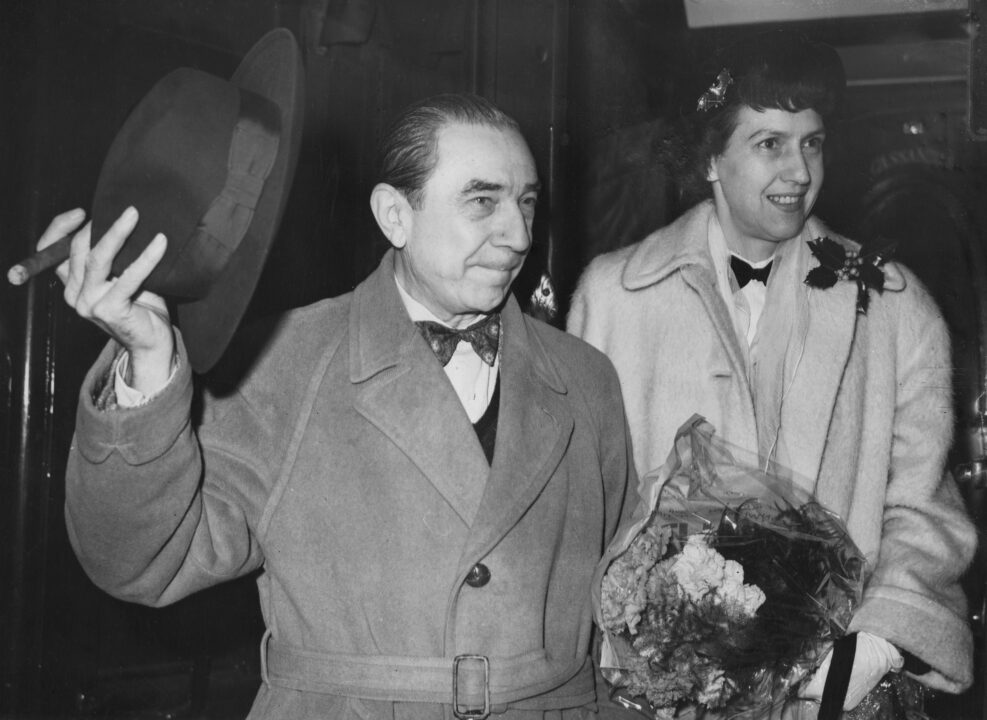 Hungarian-American actor Bela Lugosi (1882 - 1956) and his wife Lillian leave Waterloo Station in London on the 'Queen Elizabeth' boat train, bound for the United States, 5th December 1951. She is wearing a brooch on her hat in the shape of a bat. 