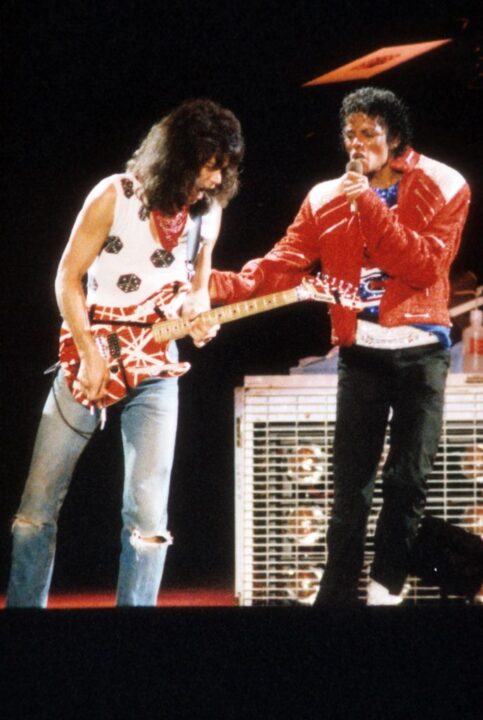 Guitarist Eddie Van Halen joins pop star Michael Jackson on stage to perform his hit song "Beat It" during The Jacksons Victory Tour on July 14, 1984 at Texas Stadium in Dallas, Texas