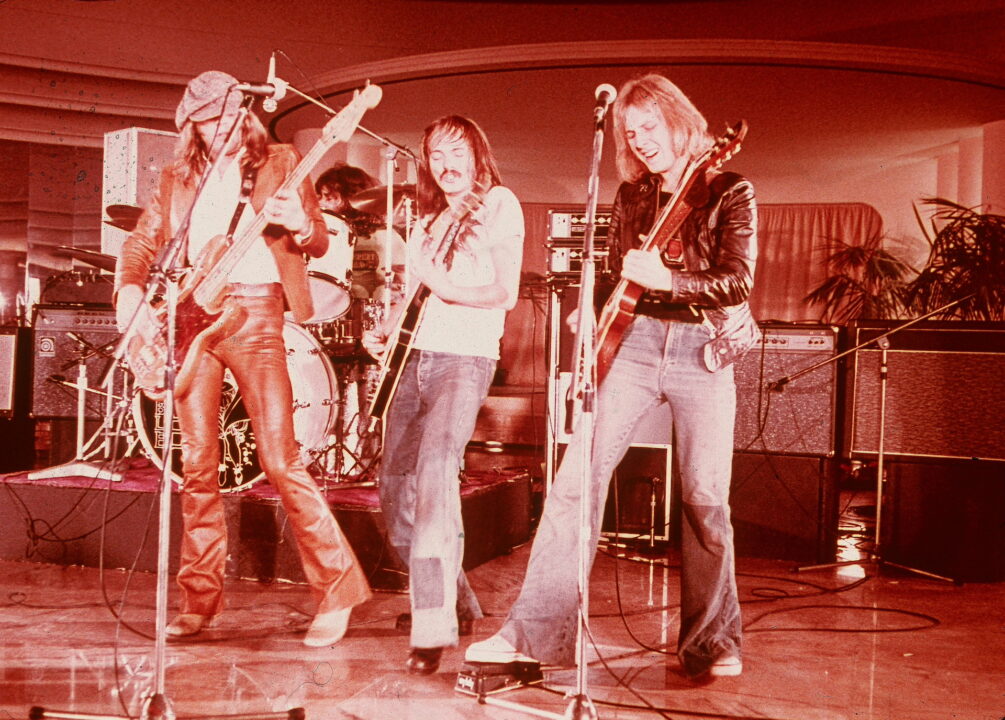 Members of the English band Humble Pie perform on an episode of the NBC television show 'Midnight Special,' circa 1970. (Right to left): Peter Frampton, Steve Marriott, Greg Ridley and Jerry Shirley on drums in background. 