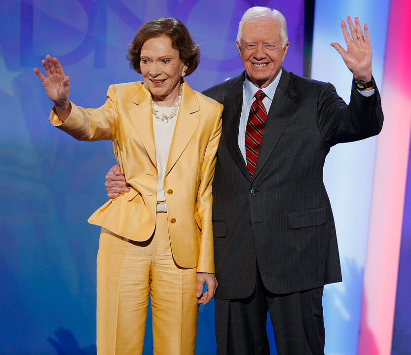 Former U.S. President Jimmy Carter (R) and former first lady Rosalynn Carter wave on stage during day one of the Democratic National Convention (DNC) at the Pepsi Center August 25, 2008 in Denver, Colorado. The DNC, where U.S. Sen. Barack Obama (D-IL) will be officially nominated as the Democratic candidate for U.S. president, starts today and finishes August 28th