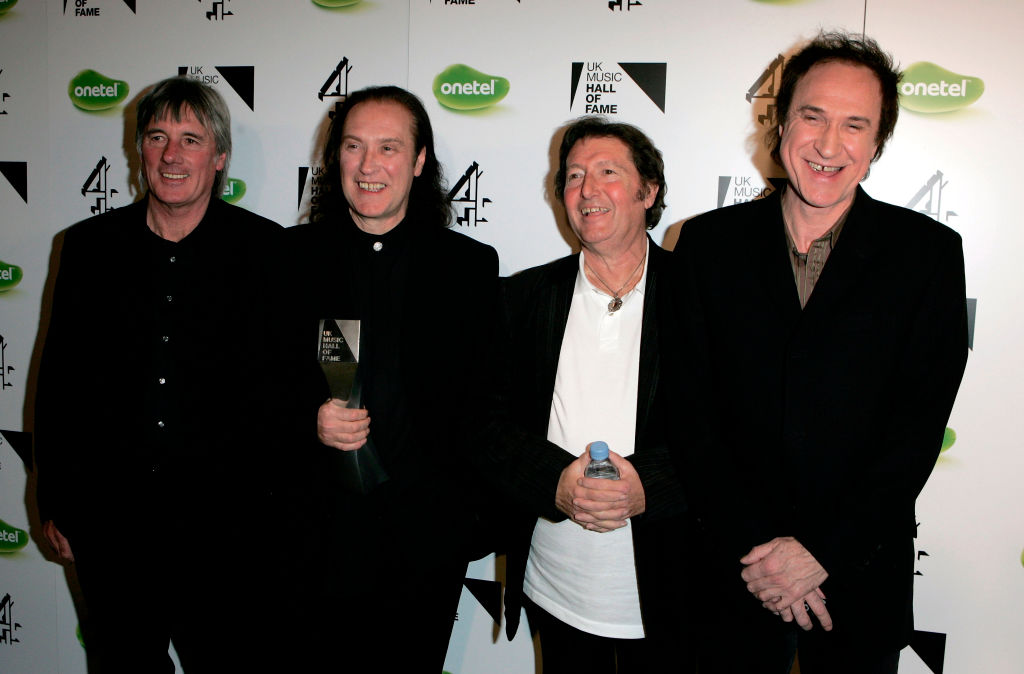 LONDON - NOVEMBER 16: (L-R) The Kinks band members Mick Avory, Dave Davies, Peter Quaife and Ray Davies pose backstage with the award for their induction into the UK Music Hall Of Fame 2005, the culmination of the two-week Channel 4 series looking at 1950's-1990's popular music, at Alexandra Palace on November 16, 2005 in London, England. Acts are selected by a panel of over 60 artists, journalists, broadcasters and executives, with artists including Alanis Morissette, The Pretenders and Slash paying tribute to their fellow musical artists at the event