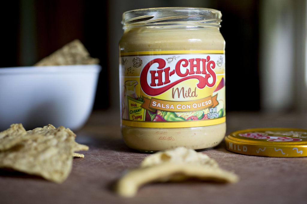 A jar of Hormel Foods Corp. Chi-Chi's brand salsa con queso is arranged for a photograph in Tiskilwa, Illinois, U.S., on Thursday, May 17, 2018. Hormel is scheduled to release earnings figures on May 24