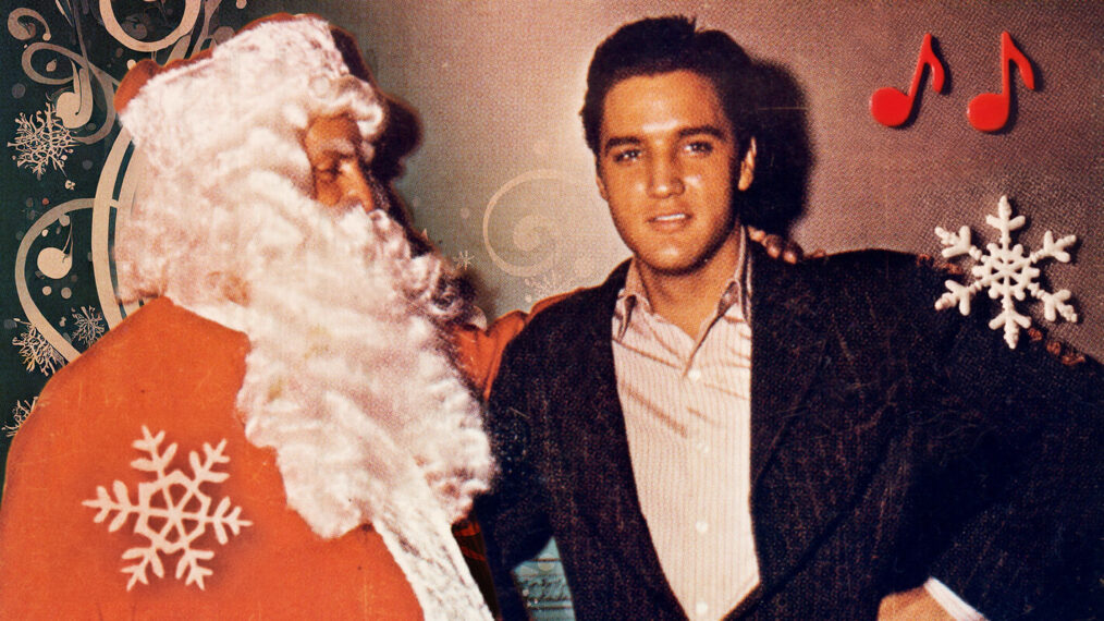 CIRCA 1965: Rock and roll singer Elvis Presley poses with Colonel Tom Parker (dressed as Santa Claus)in this Christmas card circa 1965. Altered image