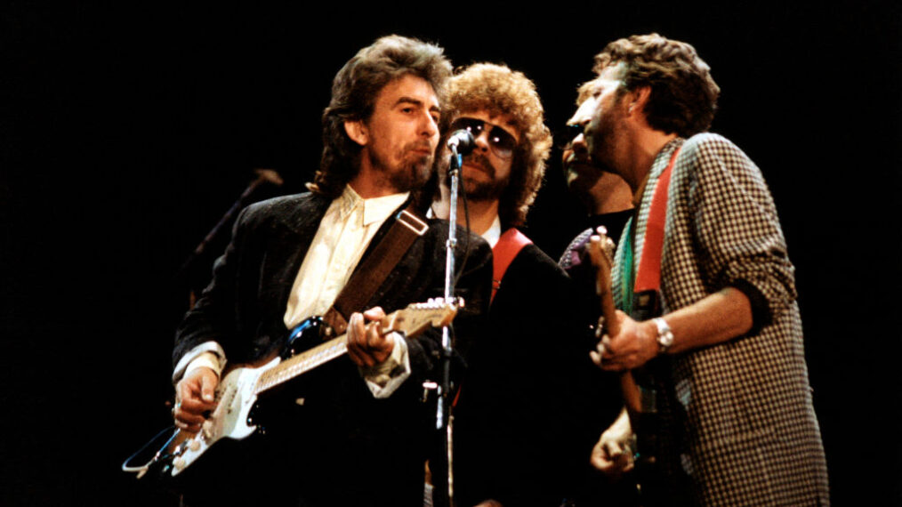 UNITED KINGDOM - JUNE 06: WEMBLEY ARENA Photo of George HARRISON and Eric CLAPTON and Jeff LYNNE, L-R: George Harrison, Jeff Lynne, Donald 'Duck' Dunn (behind), Eric Clapton, performing live onstage at the Princes Trust Concert