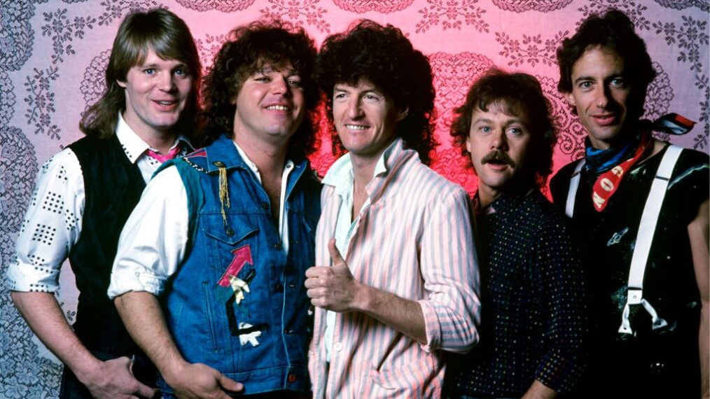 Bass guitarist Bruce Hall, lead guitarist Gary Richrath (1949-2015), rhythm guitarist and lead singer Kevin Cronin, keyboardist Neal Doughty, and drummer Alan Gratzer, all of the American rock band REO Speedwagon, pose for a portrait backstage at the Joe Louis Arena on March 27, 1981, in Detroit, Michigan