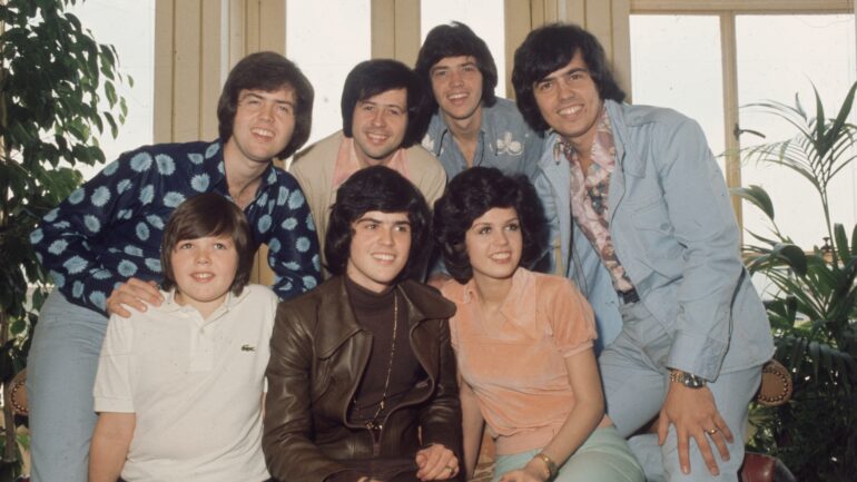 circa 1975: The Osmonds, known as the first family of pop. In the front row are (left to right) Jimmy, Donny and Marie Osmond. Behind them are brothers Alan, Wayne, Merrill and Jay.