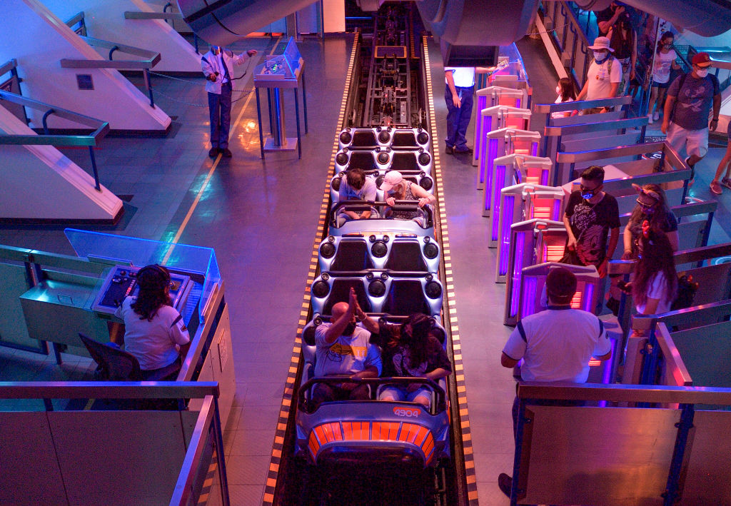 Anaheim, CA - April 30: Socially-distanced riders inside Space Mountain at Disneyland in Anaheim, CA, on Friday, April 30, 2021. The resort"u2019s parks have been closed for 412 days due to the COVID-19 outbreak