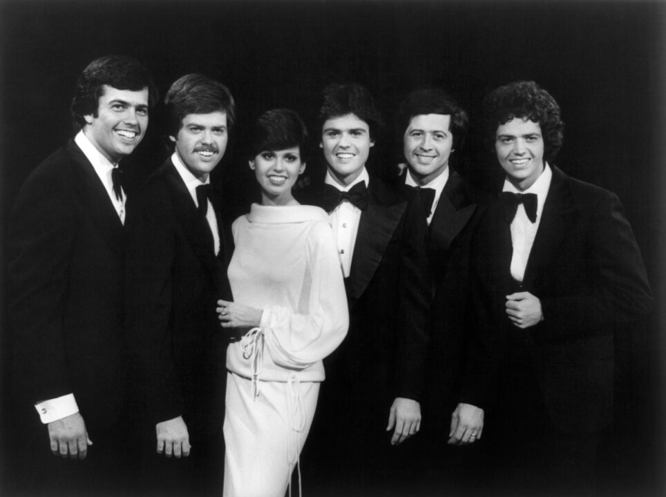 DONNY AND MARIE, from left: Alan Osmond, Merrill Osmond, Marie Osmond, Donny Osmond, Wayne Osmond, Jay Osmond, 1976-79