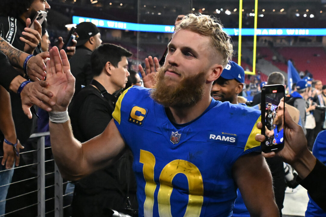 GLENDALE, ARIZONA - JANUARY 13: Cooper Kupp #10 of the Los Angeles Rams celebrates with fans after a win over the Minnesota Vikings during the NFC Wild Card Playoff at State Farm Stadium on January 13, 2025 in Glendale, Arizona. 